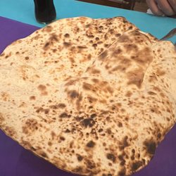 Persa - A huge piece of bread, like a lighter version of naan