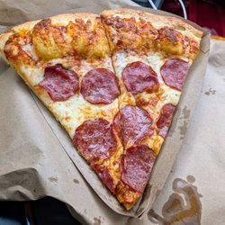 Gabriel Pizza - Even when starving.. 2 star slice. Sad. I like the location/owner. It's bland, no sauce with a 1.5 inch crust of nothingness. $6.50!