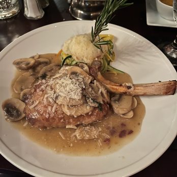 Caruso's - Stuffed Veal Chop ( stuffed with Baby Spinach and Gargonzola cheese finished in a mushroom sauce and fresh grated cheese) - Italian Near Me - Mooresville, North Carolina Caruso's - Stuffed Veal Chop ( stuffed with Baby Spinach and Gargonzola cheese finished in a mushroom sauce and fresh grated cheese) - Italian Near Me - Mooresville, North Carolina