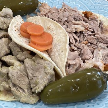 Jalisco Restaurant - Tacos on dinner plate. Pork in green sauce (L) & carnitas tacos (R) with pickled carrots and jalapeños (on the side) $4.58 each - Mexican Near Me - Oakland, California Jalisco Restaurant - Tacos on dinner plate. Pork in green sauce (L) & carnitas tacos (R) with pickled carrots and jalapeños (on the side) $4.58 each - Mexican Near Me - Oakland, California