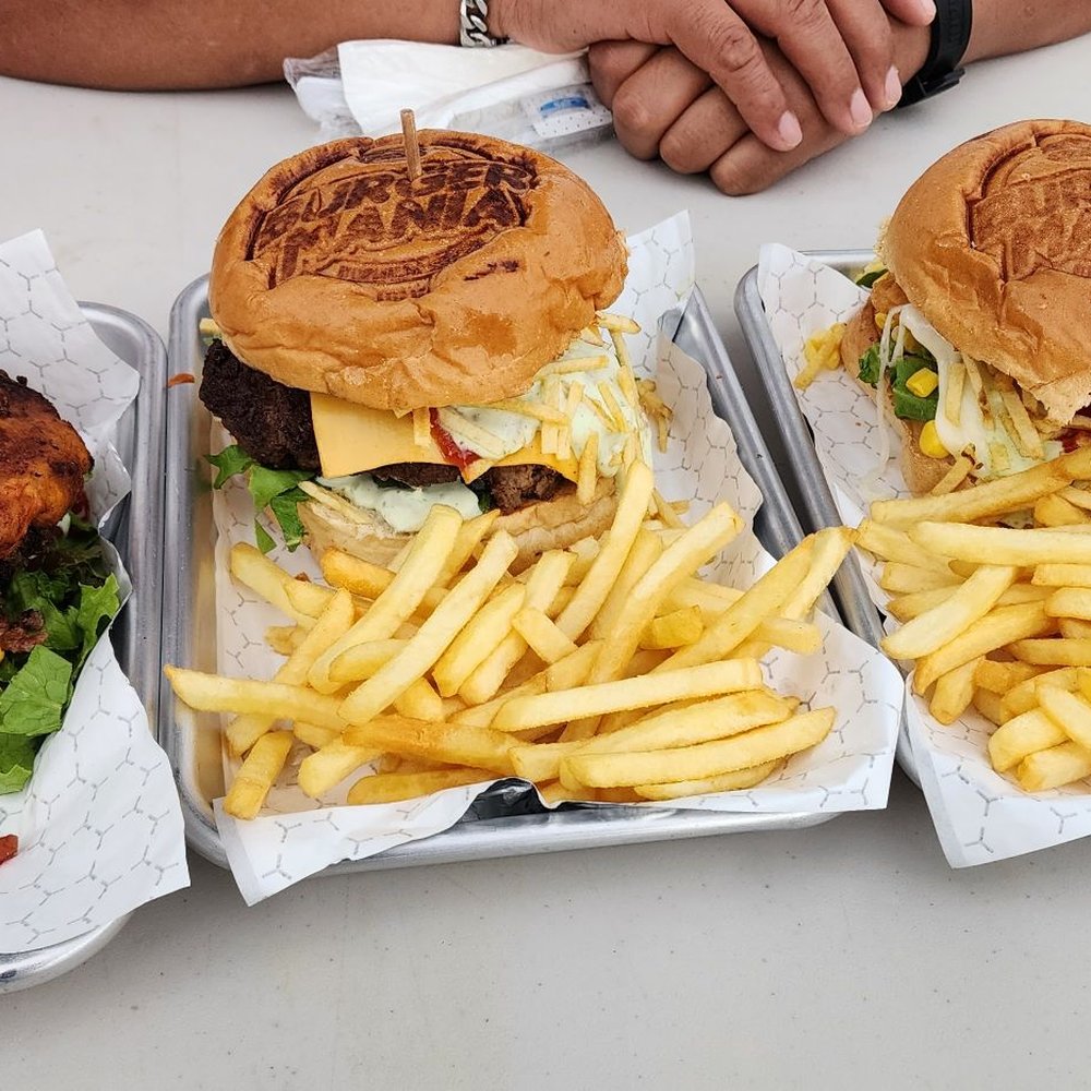Burger Mania - three trays of burgers and fries - Food Trucks Near Me - Miami, Florida Burger Mania - three trays of burgers and fries - Food Trucks Near Me - Miami, Florida