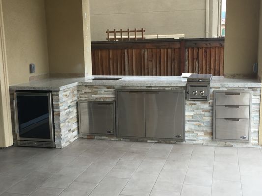 Outdoor Kitchen - This remodel not only enhances the functionality of the outdoor kitchen but also increases the aesthetic appeal and overall enjoyment of outdoor entertaining.