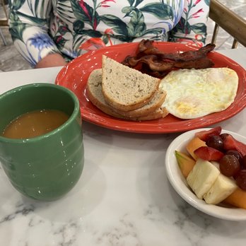 Yours Truly Restaurant - Two eggs over medium with rye toast and a fruit cup substitution for potatoes. - American Near Me - Cleveland, Ohio Yours Truly Restaurant - Two eggs over medium with rye toast and a fruit cup substitution for potatoes. - American Near Me - Cleveland, Ohio