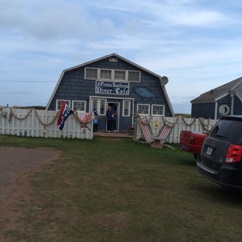 Pirates Boathouse Cafe - a car parked in front of it - Seafood Near Me - Souris, Prince Edward Island Pirates Boathouse Cafe - a car parked in front of it - Seafood Near Me - Souris, Prince Edward Island