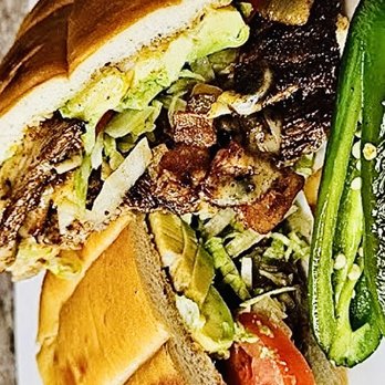 ChorizoFood - a sandwich and a pickle on a plate - Food Trucks Near Me - Hayward, California ChorizoFood - a sandwich and a pickle on a plate - Food Trucks Near Me - Hayward, California