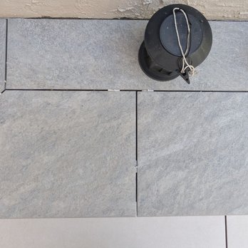 FG Pavers and Turf - Tile work on a patio step before the grout was added. - Landscaping Near Me