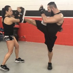 Grind Fitness - Our Combat Group Classes partners you up to hit the pads!
