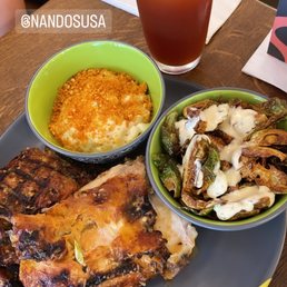 Half chicken with Mac and cheese and crispy Brussels sprouts and peach iced tea. Half chicken with Mac and cheese and crispy Brussels sprouts and peach iced tea.