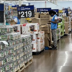 Walmart Supercenter - This is the average Walmart employee here. They've been looking at their phones the whole time.
