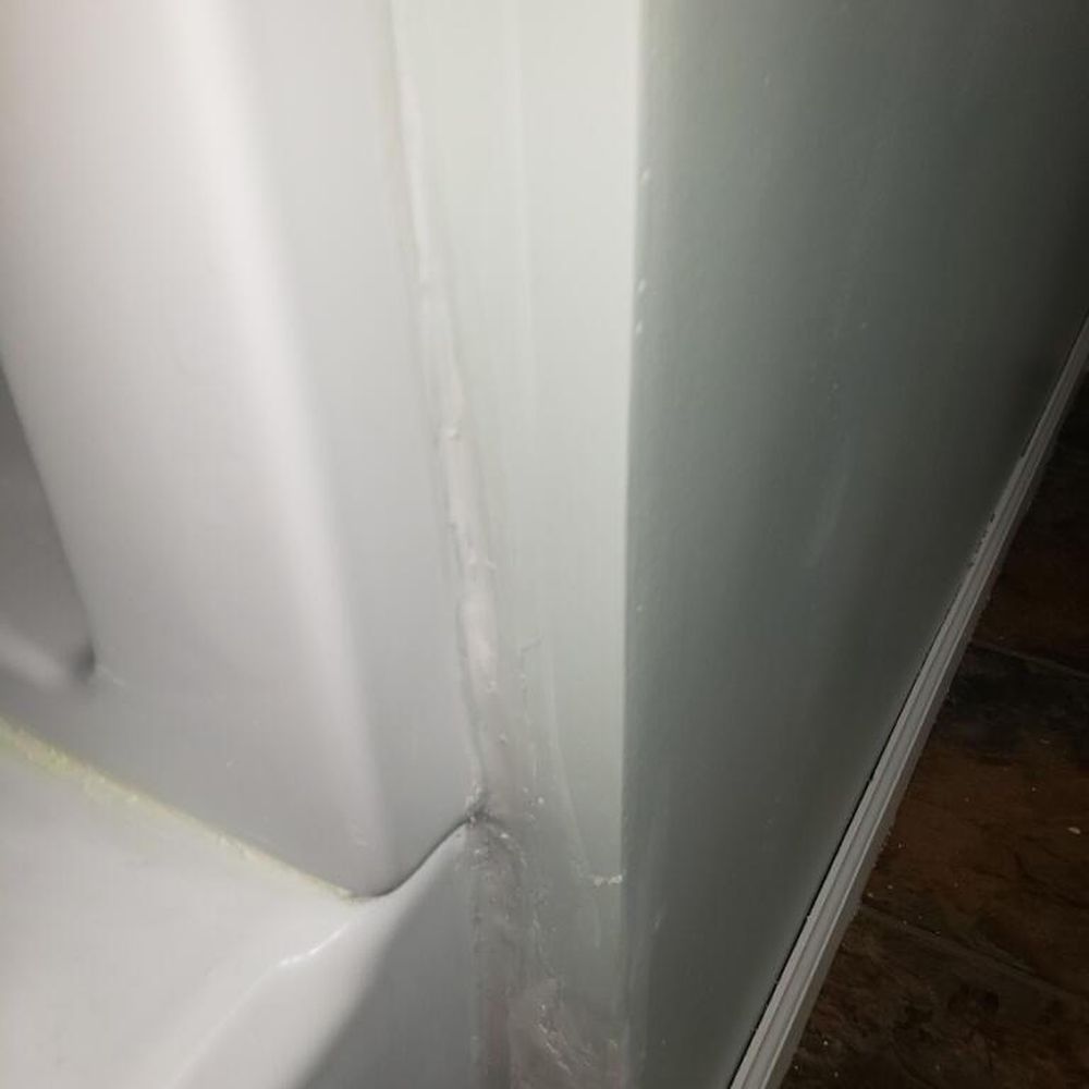 EZ Acceptance Builders - The siding of the tub that is also now leaking - General Contractors Near Me - Akron, Ohio EZ Acceptance Builders - The siding of the tub that is also now leaking - General Contractors Near Me - Akron, Ohio