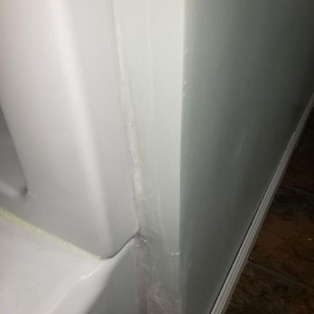 EZ Acceptance Builders - The siding of the tub that is also now leaking - General Contractors Near Me - Akron, Ohio