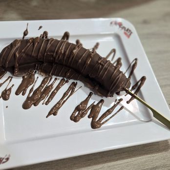 Chocolate Bash - Frozen Banana w Belgian Milk Chocolate - Coffee & Tea Near Me - Long Beach, California Chocolate Bash - Frozen Banana w Belgian Milk Chocolate - Coffee & Tea Near Me - Long Beach, California