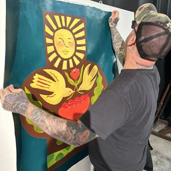 Space Station Studio - Artist Scott White helping hang Jennyfer Marie's artwork for a group art show. - Art Galleries Near Me - Orlando, Florida Space Station Studio - Artist Scott White helping hang Jennyfer Marie's artwork for a group art show. - Art Galleries Near Me - Orlando, Florida
