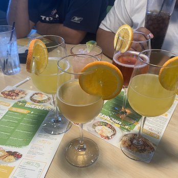 The Toasted Yolk Cafe - Pineapple mimosa Apple mimosa Cranberry mimosa - Breakfast & Brunch Near Me - Beaumont, Texas The Toasted Yolk Cafe - Pineapple mimosa Apple mimosa Cranberry mimosa - Breakfast & Brunch Near Me - Beaumont, Texas