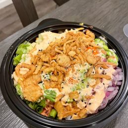 I got a salmon and spicy tuna bowl with tons of toppings. Tastes really fresh I got a salmon and spicy tuna bowl with tons of toppings. Tastes really fresh