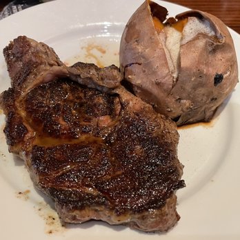 LongHorn Steakhouse - Medium rare ribeye steak with a sweet potato- yum! - Steakhouses Near Me - Austin, Texas