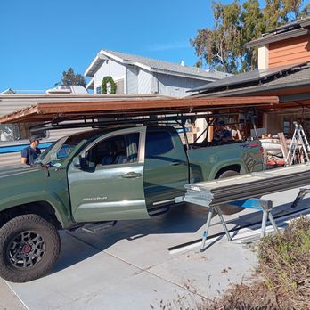2 Brother's Garage Doors - The truck with the removed old garage door. - Garage Door Services Near Me - Oceanside, California