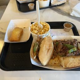 brisket cheesesteak sandwich with mac n cheese and corn bread brisket cheesesteak sandwich with mac n cheese and corn bread