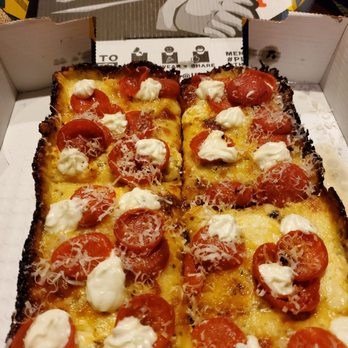 Izzy's Pizza Bus - White Pizza, Vanilla Ice, with pepperoni added - Food Trucks Near Me - Omaha, Nebraska