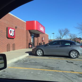 QuikTrip - a car parked in a parking lot - Gas Stations Near Me - Des Moines, Iowa