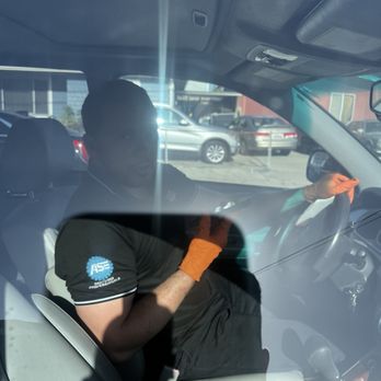 Pit Stop Auto Service - Pit stop worker is on his phone while driving customer vehicle - Auto Repair Near Me - San Bruno, California