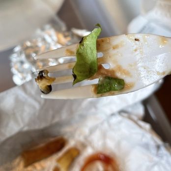 Spanky's Burgers - a fork holding a piece of pizza - Burgers Near Me - Brownsville, Texas Spanky's Burgers - a fork holding a piece of pizza - Burgers Near Me - Brownsville, Texas