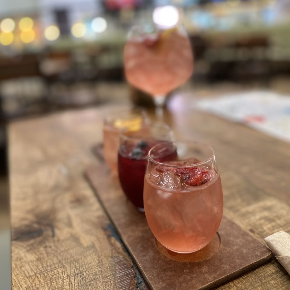 California Pizza Kitchen - three glasses of wine on a cutting board - Pizza Near Me - Atlanta, Georgia California Pizza Kitchen - three glasses of wine on a cutting board - Pizza Near Me - Atlanta, Georgia