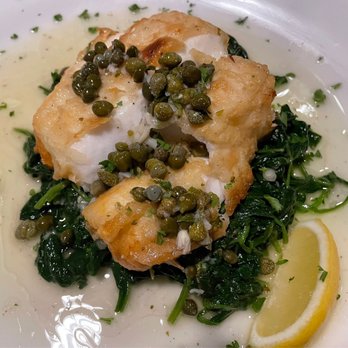 Cafe Napoli - Chilean Sea Bass with sautéed spinach, capers, lemon garlic sauce - Italian Near Me - Clayton, Missouri