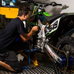 Owner Aaron Barnum customizing a dirt bike with Dyno Tuning