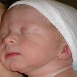 Metropolitan Breastfeeding - Getting ready to breastfeed right after I am placed " skin to skin."