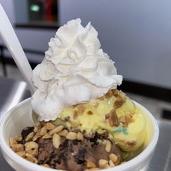 Sweets On Main - Two scoop bowl with Michigan pothole and anniversary cake ice cream with peanuts and whipped cream