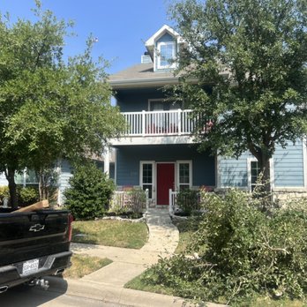 Newvision Landscaping - the front of a home in a neighborhood - Lawn Services Near Me