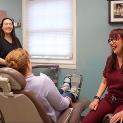 Flanders Dental Studio - Dr. Stephanie Mastrota and assistant talking to a patient