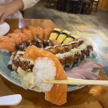 Sakura Nami - a plate of sushi with chopsticks - Sushi Bars Near Me - Clarendon Hills, Illinois Sakura Nami - a plate of sushi with chopsticks - Sushi Bars Near Me - Clarendon Hills, Illinois