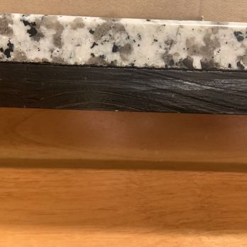 Morrison Construction - Piece of wood glued to granite countertop - Roofing Near Me - Portland, Oregon Morrison Construction - Piece of wood glued to granite countertop - Roofing Near Me - Portland, Oregon