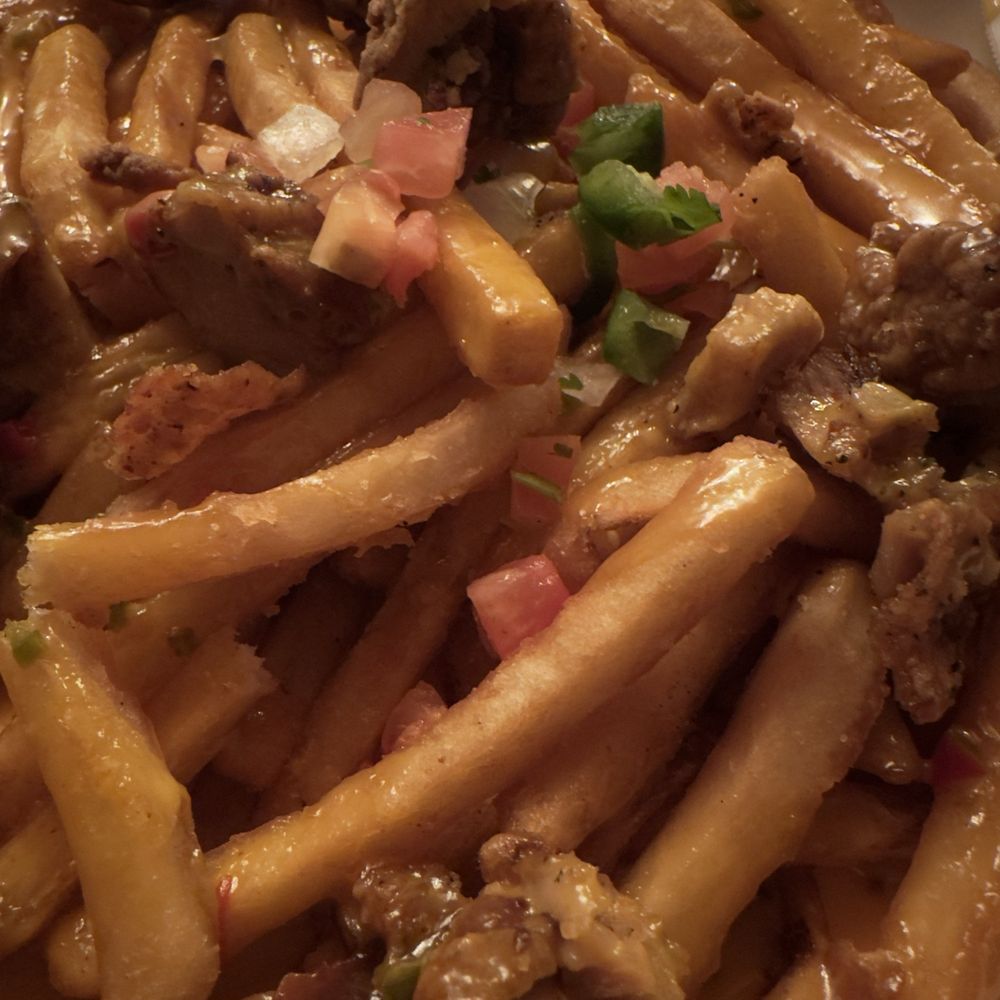 Lost & Found - Cheese smothered fries with cheese & fried chicken - Cocktail Bars Near Me - Houston, Texas Lost & Found - Cheese smothered fries with cheese & fried chicken - Cocktail Bars Near Me - Houston, Texas
