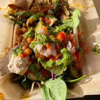 Hummus Way - Open-face pita wrap, with mushroom shwarma, hummus, spinach, hot sauce and zhoug (vegan) - Mediterranean Near Me - Orange, California Hummus Way - Open-face pita wrap, with mushroom shwarma, hummus, spinach, hot sauce and zhoug (vegan) - Mediterranean Near Me - Orange, California