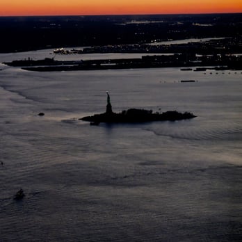 One World Observatory - Lady Liberty setting into the sun. - Observatories Near Me - New York, New York