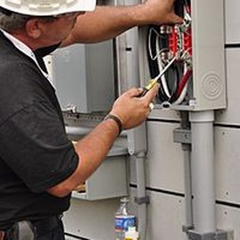 MA Electric - a man working on an electrical panel - Electricians Near Me - Greensboro, North Carolina MA Electric - a man working on an electrical panel - Electricians Near Me - Greensboro, North Carolina