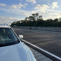AAMCO Transmissions & Total Car Care - Tire stopped across the highway next to the vehicle. Luckily it didn't hurt or hit anyone.