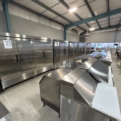 A full showroom featuring commercial reach-in refrigerators, ice machines, and essential kitchen equipment built for real foodservice operat