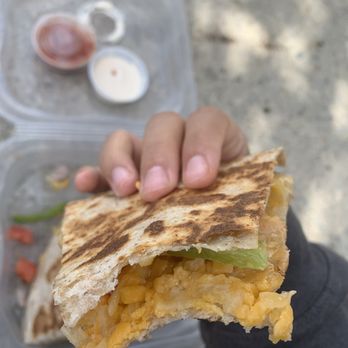 Burrito Boyz - a hand holding a sandwich - Tex-Mex Near Me - Mississauga, Ontario Burrito Boyz - a hand holding a sandwich - Tex-Mex Near Me - Mississauga, Ontario