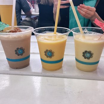 Frita Batidos - L to R: chocolate, "lighter batido, and passion fruit batido. $5 each. Kinda pricey but definitely worth a try! - Cuban Near Me - Ann Arbor, Michigan