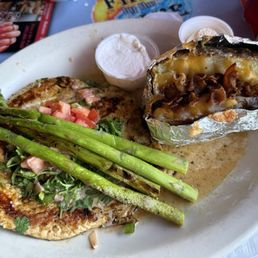 Lime chicken, asparagus, and loaded baked potato. Lime chicken, asparagus, and loaded baked potato.