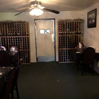 Pasta House - One of the rooms with wine racks in the wall. - Italian Near Me - Pinetop, Arizona