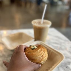 Inclusion Coffee - Latte and spinach cruffin