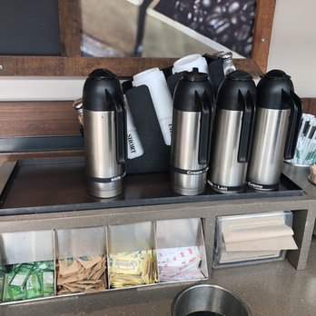 Starbucks - a display of coffee and tea in a coffee shop - Coffee & Tea Near Me - Vancouver, British Columbia