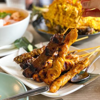Banana Leaf - grilled chicken skewers on a plate - Malaysian Near Me - Vancouver, British Columbia