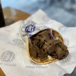 a pita with meat and onions a pita with meat and onions