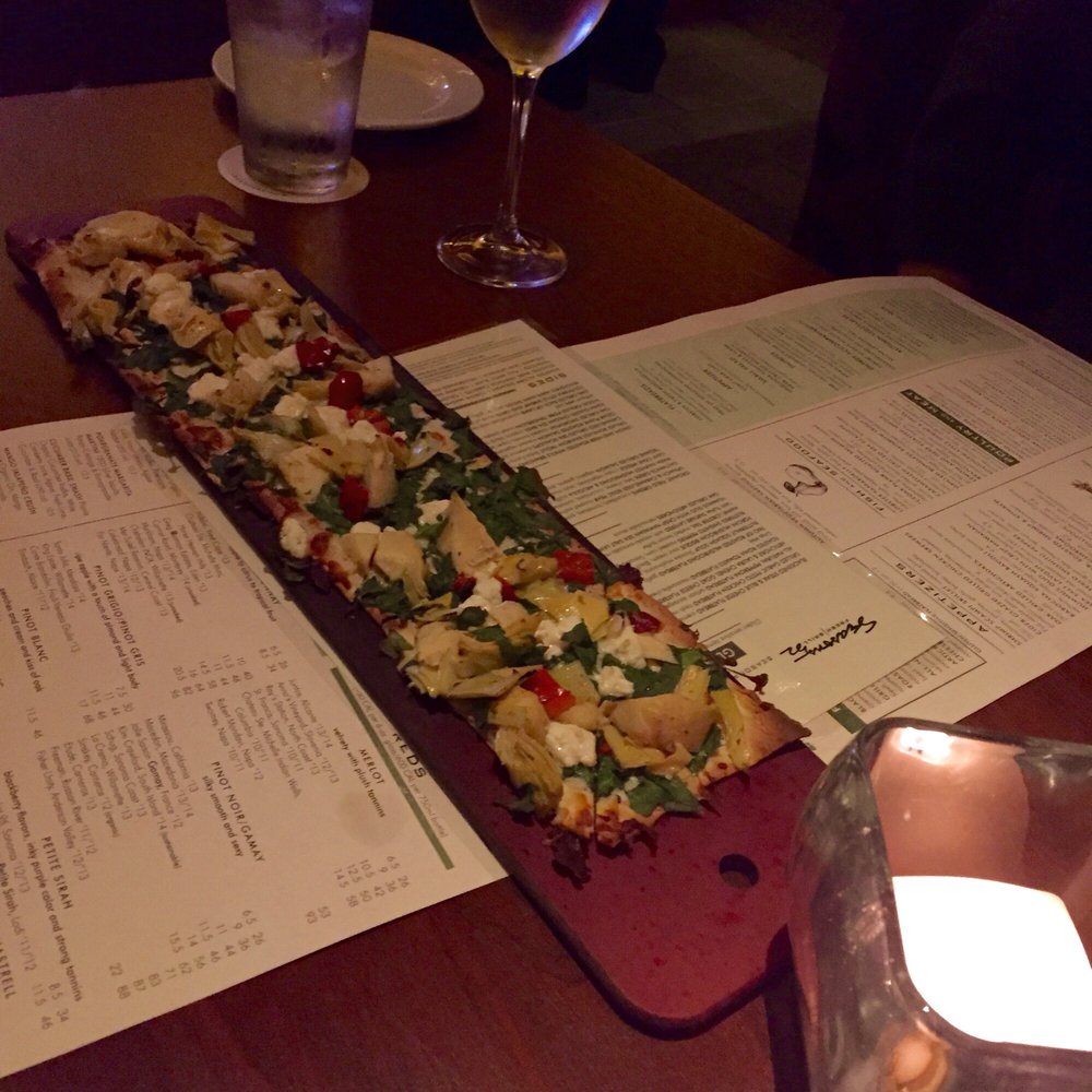 Seasons 52 - ARTICHOKE & LAURA CHENEL GOAT CHEESE FLATBREAD (on gluten free flatbread) Light, crisp, and full of flavor. Great for two! - New American Near Me - Houston, Texas Seasons 52 - ARTICHOKE & LAURA CHENEL GOAT CHEESE FLATBREAD (on gluten free flatbread) Light, crisp, and full of flavor. Great for two! - New American Near Me - Houston, Texas